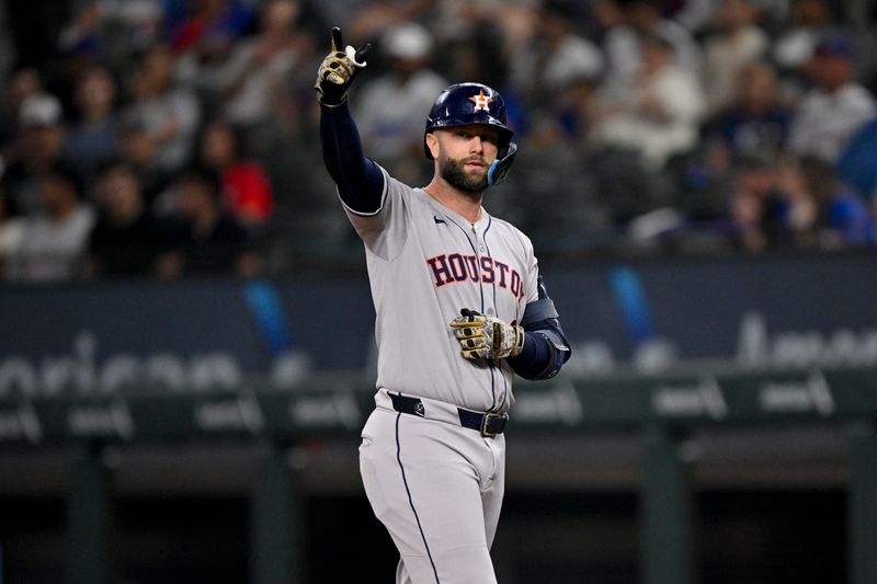 May 16, 2025; Arlington, Texas, USA; Houston Astros first baseman Christian Walker (8) motions to the dugout after hitting a single against the Texas Rangers during the first inning at Globe Life Field. Mandatory Credit: Jerome Miron-Imagn Images