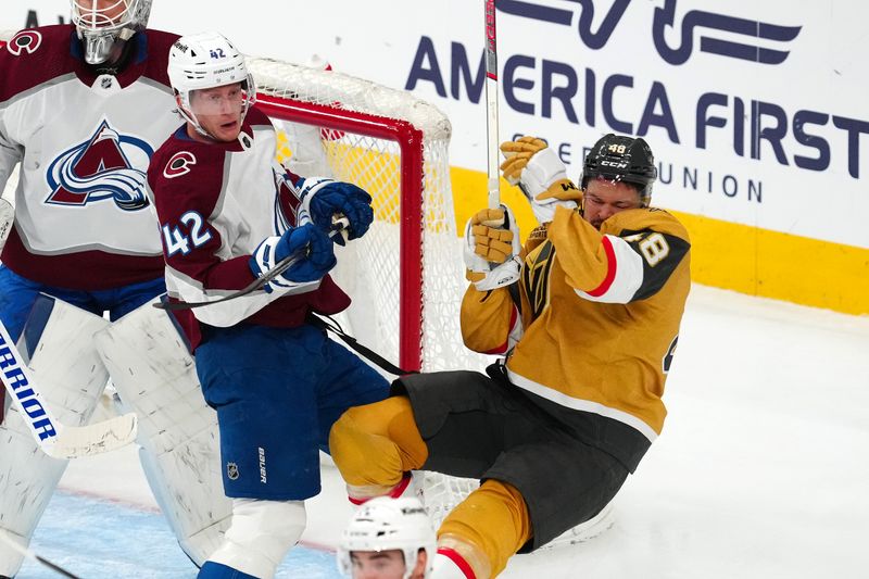 Apr 14, 2024; Las Vegas, Nevada, USA; Colorado Avalanche defenseman Josh Manson (42) checks Vegas Golden Knights center Tomas Hertl (48) in the third period at T-Mobile Arena. Manson was penalized for interference on the play. Mandatory Credit: Stephen R. Sylvanie-USA TODAY Sports