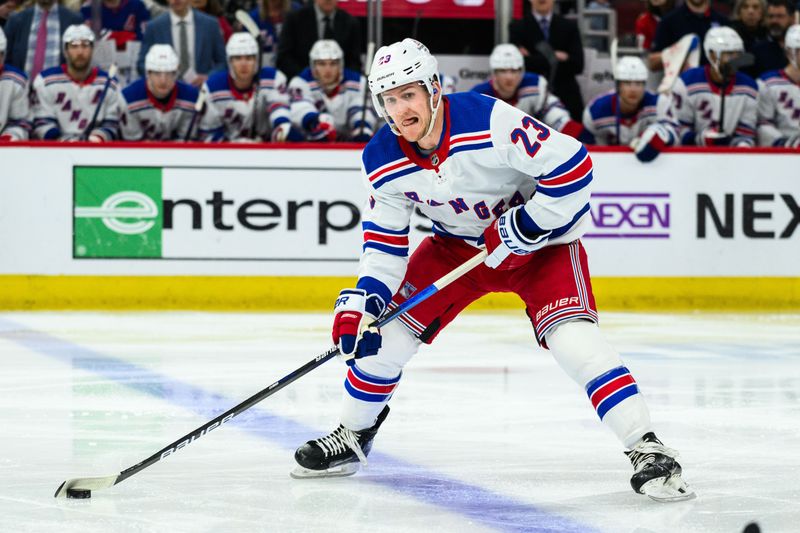 Feb 9, 2024; Chicago, Illinois, USA; New York Rangers defenseman Adam Fox (23) skates with the puck against the Chicago Blackhawks during the second period at the United Center. Mandatory Credit: Daniel Bartel-USA TODAY Sports