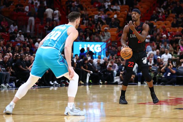 MIAMI, FLORIDA - DECEMBER 13: Jimmy Butler #22 of the Miami Heat dribbles the ball against the Charlotte Hornets during the first quarter of the game at Kaseya Center on December 13, 2023 in Miami, Florida. NOTE TO USER: User expressly acknowledges and agrees that, by downloading and or using this photograph, User is consenting to the terms and conditions of the Getty Images License Agreement. (Photo by Megan Briggs/Getty Images)