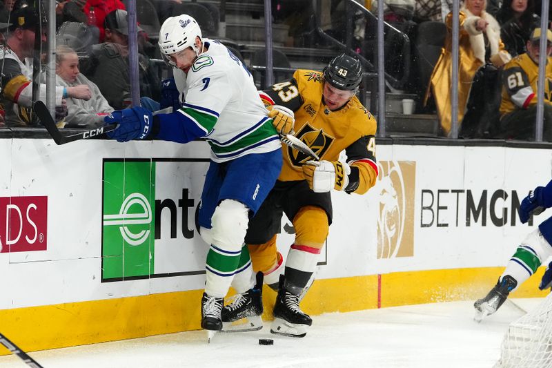 Mar 7, 2024; Las Vegas, Nevada, USA; Vancouver Canucks defenseman Carson Soucy (7) keeps the puck away from Vegas Golden Knights center Paul Cotter (43) during the second period at T-Mobile Arena. Mandatory Credit: Stephen R. Sylvanie-USA TODAY Sports