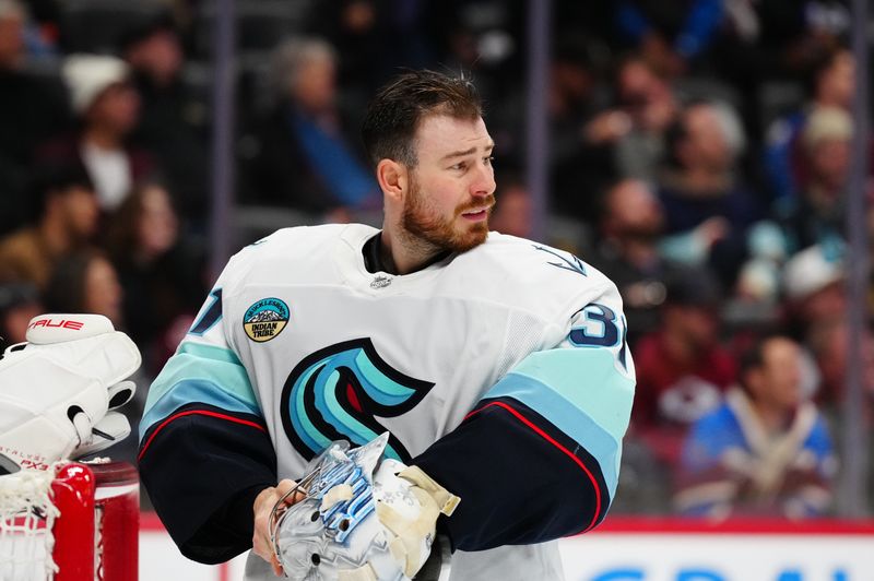 Nov 5, 2024; Denver, Colorado, USA; Seattle Kraken goaltender Philipp Grubauer (31) during a time out in the second period against the Colorado Avalanche at Ball Arena. Mandatory Credit: Ron Chenoy-Imagn Images