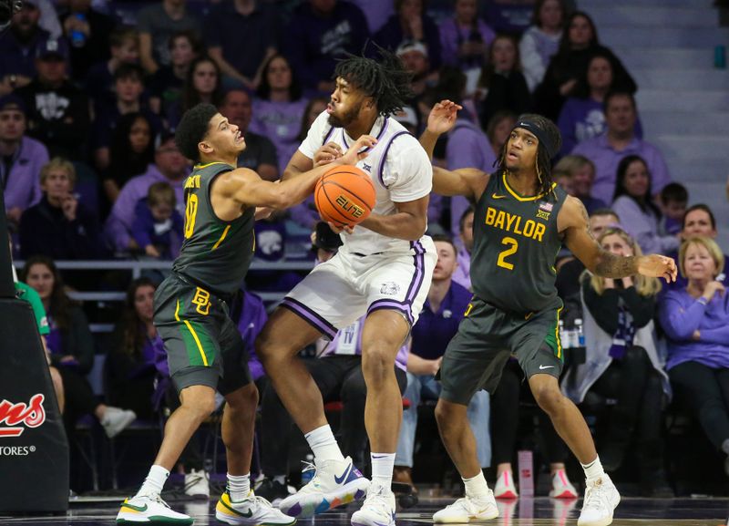 Jan 16, 2024; Manhattan, Kansas, USA; Kansas State Wildcats center Will McNair Jr. (13) is guarded by Baylor Bears guard RayJ Dennis (10) and guard Jayden Nunn (2) during the second half at Bramlage Coliseum. Mandatory Credit: Scott Sewell-USA TODAY Sports