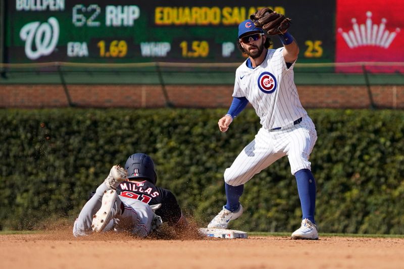 Sep 20, 2024; Chicago, Illinois, USA;Washington Nationals catcher Drew Millas (81) is forced out by Chicago Cubs shortstop Dansby Swanson (7) at second base during the seventh inning at Wrigley Field. Mandatory Credit: David Banks-Imagn Images