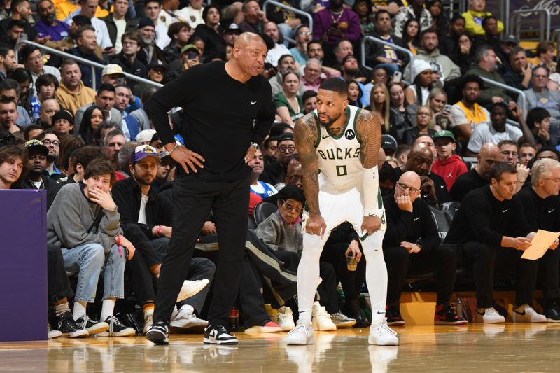 LOS ANGELES, CA - MARCH 8: Damian Lillard #0 and Head Coach Doc Rivers of the Milwaukee Bucks talk during the game against the Los Angeles Lakers on March 8, 2024 at Crypto.Com Arena in Los Angeles, California. NOTE TO USER: User expressly acknowledges and agrees that, by downloading and/or using this Photograph, user is consenting to the terms and conditions of the Getty Images License Agreement. Mandatory Copyright Notice: Copyright 2024 NBAE (Photo by Andrew D. Bernstein/NBAE via Getty Images)