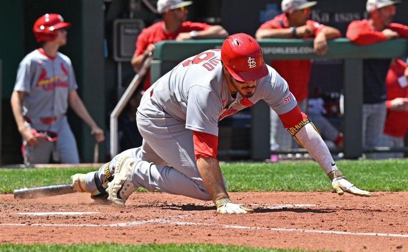 May 18, 2025; Kansas City, Missouri, USA;  St. Louis Cardinals third baseman Nolan Arenado (28) falls down after hitting a single in the fifth inning against the Kansas City Royals at Kauffman Stadium. Mandatory Credit: Peter Aiken-Imagn Images