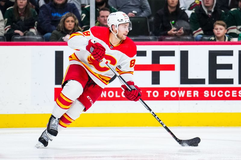 Jan 2, 2024; Saint Paul, Minnesota, USA; Calgary Flames left wing Andrew Mangiapane (88) carries the puck during the second period against the Minnesota Wild at Xcel Energy Center. Mandatory Credit: Brace Hemmelgarn-USA TODAY Sports