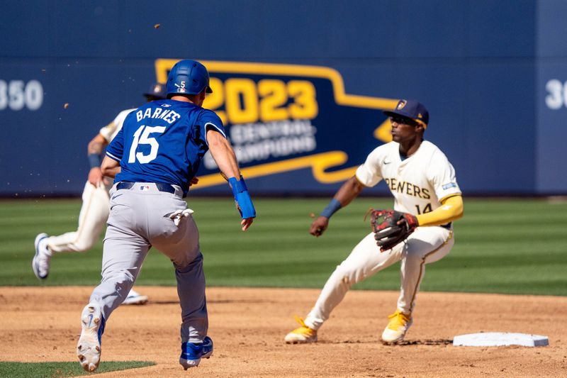 Mar 2, 2024; Phoenix, Arizona, USA; Los Angeles Dodgers catcher Austin Barnes (15) runs to beat the throw to second base in the third inning during a spring training game against the Milwaukee Brewers at American Family Fields of Phoenix. Mandatory Credit: Allan Henry-USA TODAY Sports