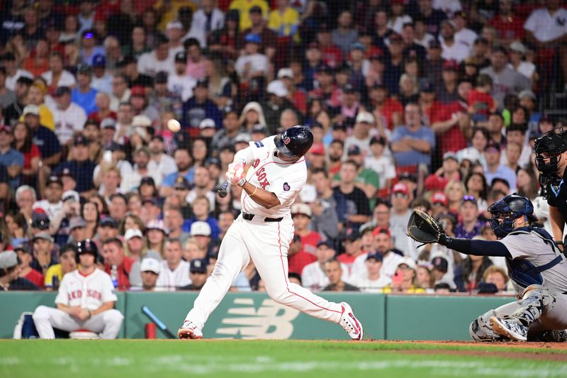 Jul 28, 2024; Boston, Massachusetts, USA; Boston Red Sox third baseman Rafael Devers (11) hits a triple against the New York Yankees during the fourth inning at Fenway Park. Mandatory Credit: Eric Canha-USA TODAY Sports