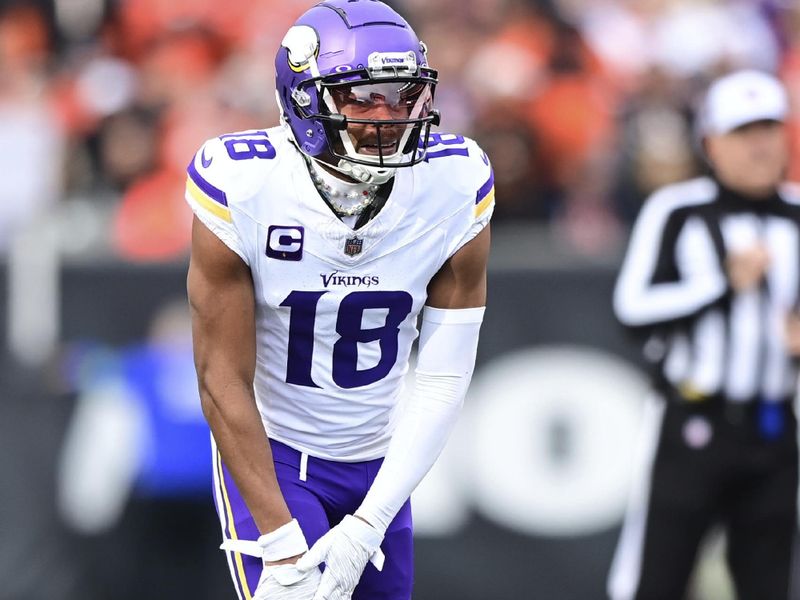 Minnesota Vikings wide receiver Justin Jefferson (18) lines up for the play during an NFL football game against the Cincinnati Bengals on Saturday, Dec. 16, 2023, in Cincinnati. (AP Photo/Emilee Chinn)