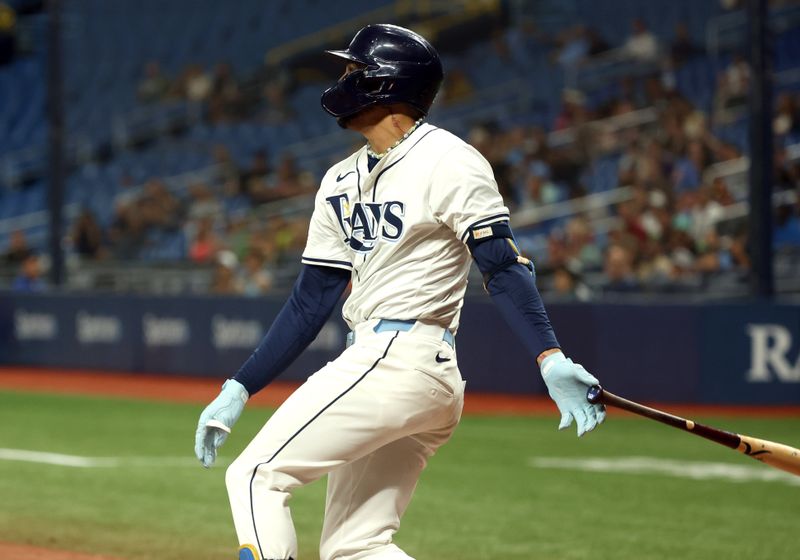 Sep 17, 2024; St. Petersburg, Florida, USA; Tampa Bay Rays outfielder Jose Siri (22) hits a 3-RBI double against the Boston Red Sox during the eighth inning at Tropicana Field. Mandatory Credit: Kim Klement Neitzel-Imagn Images