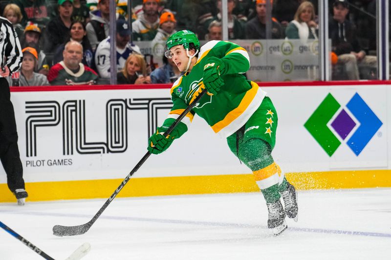 Nov 3, 2024; Saint Paul, Minnesota, USA; Minnesota Wild defenseman Brock Faber (7) shoots during the second period against the Toronto Maple Leafs at Xcel Energy Center. Mandatory Credit: Brace Hemmelgarn-Imagn Images