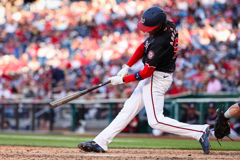 Apr 20, 2024; Washington, District of Columbia, USA; Washington Nationals shortstop CJ Abrams (5) doubles against the Houston Astros during the ninth inning at Nationals Park. Mandatory Credit: Scott Taetsch-USA TODAY Sports