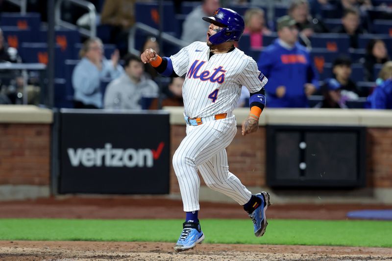Apr 12, 2024; New York City, New York, USA; New York Mets catcher Francisco Alvarez (4) reacts as he scores a run against the Kansas City Royals on a single by designated hitter DJ Stewart (not pictured) during the fourth inning at Citi Field. Mandatory Credit: Brad Penner-USA TODAY Sports
