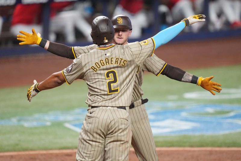 Aug 10, 2024; Miami, Florida, USA;  San Diego Padres second baseman Xander Bogaerts (2) congratulates center fielder Jackson Merrill (3) on a two-run home run in the eighth inning against the Miami Marlins at loanDepot Park. Mandatory Credit: Jim Rassol-USA TODAY Sports