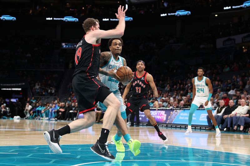 CHARLOTTE, NC - FEBRUARY 7:  P.J. Washington #25 of the Charlotte Hornets drives to the basket during the game against the Toronto Raptors on February 7, 2024 at Spectrum Center in Charlotte, North Carolina. NOTE TO USER: User expressly acknowledges and agrees that, by downloading and or using this photograph, User is consenting to the terms and conditions of the Getty Images License Agreement.  Mandatory Copyright Notice:  Copyright 2024 NBAE (Photo by Brock Williams-Smith/NBAE via Getty Images)