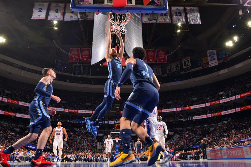 PHILADELPHIA, PA - NOVEMBER 2: Jay Huff #30 of the Memphis Grizzlies drives to the basket during the game against the Philadelphia 76ers on November 2, 2024 at the Wells Fargo Center in Philadelphia, Pennsylvania NOTE TO USER: User expressly acknowledges and agrees that, by downloading and/or using this Photograph, user is consenting to the terms and conditions of the Getty Images License Agreement. Mandatory Copyright Notice: Copyright 2024 NBAE (Photo by Jesse D. Garrabrant/NBAE via Getty Images)