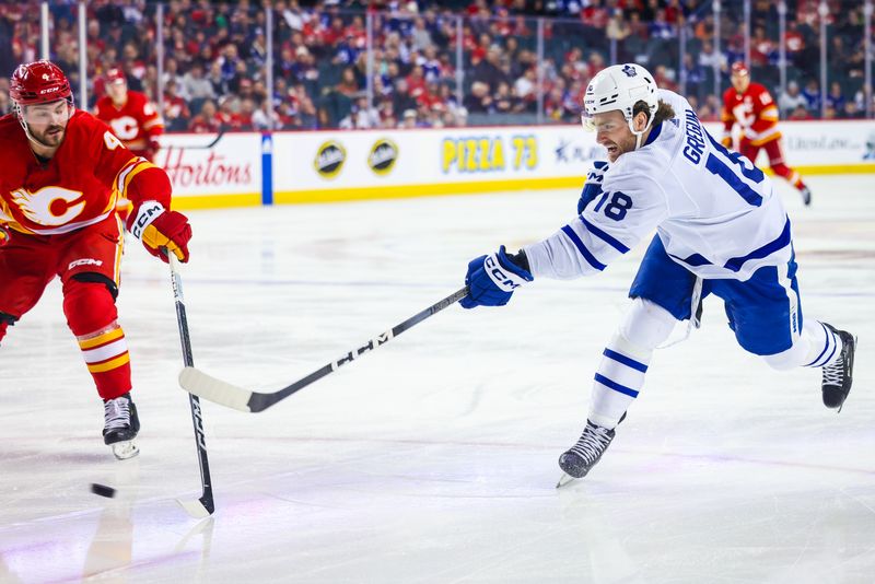 Jan 18, 2024; Calgary, Alberta, CAN; Toronto Maple Leafs center Noah Gregor (18) shoots the puck against the Calgary Flames during the first period at Scotiabank Saddledome. Mandatory Credit: Sergei Belski-USA TODAY Sports