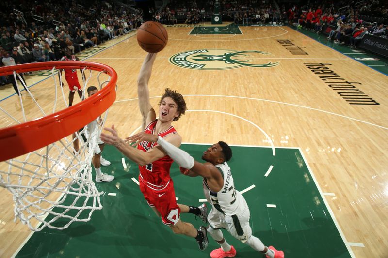 MILWAUKEE, WI - OCTOBER 14: Matas Buzelis #14 of Chicago Bulls shoots the ball during the game against the Milwaukee Bucks on October 14, 2024 at Fiserv Forum Center in Milwaukee, Wisconsin. NOTE TO USER: User expressly acknowledges and agrees that, by downloading and or using this Photograph, user is consenting to the terms and conditions of the Getty Images License Agreement. Mandatory Copyright Notice: Copyright 2024 NBAE (Photo by Gary Dineen/NBAE via Getty Images).