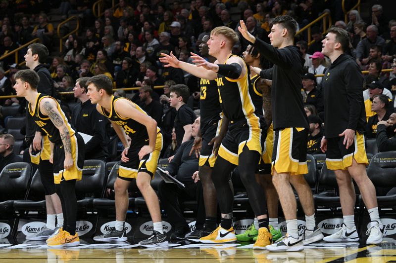 Feb 17, 2024; Iowa City, Iowa, USA; The Iowa Hawkeyes bench reacts during the second half against the Wisconsin Badgers at Carver-Hawkeye Arena. Mandatory Credit: Jeffrey Becker-USA TODAY Sports