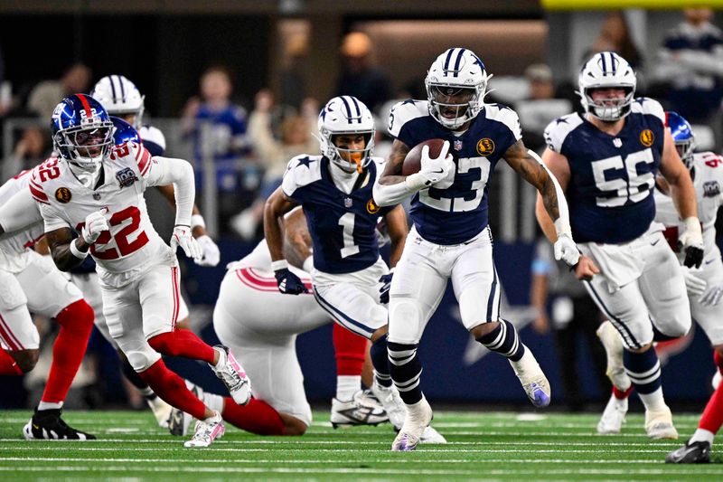 Dallas Cowboys running back Rico Dowdle (23) runs against the New York Giants during the first half of an NFL football game in Arlington, Texas, Thursday, Nov. 28, 2024. (AP Photo/Jerome Miron)