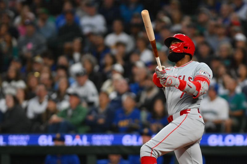 May 31, 2024; Seattle, Washington, USA; Los Angeles Angels pinch hitter Jo Adell (7) hits a grand slam against the Seattle Mariners during the seventh inning at T-Mobile Park. Mandatory Credit: Steven Bisig-USA TODAY Sports