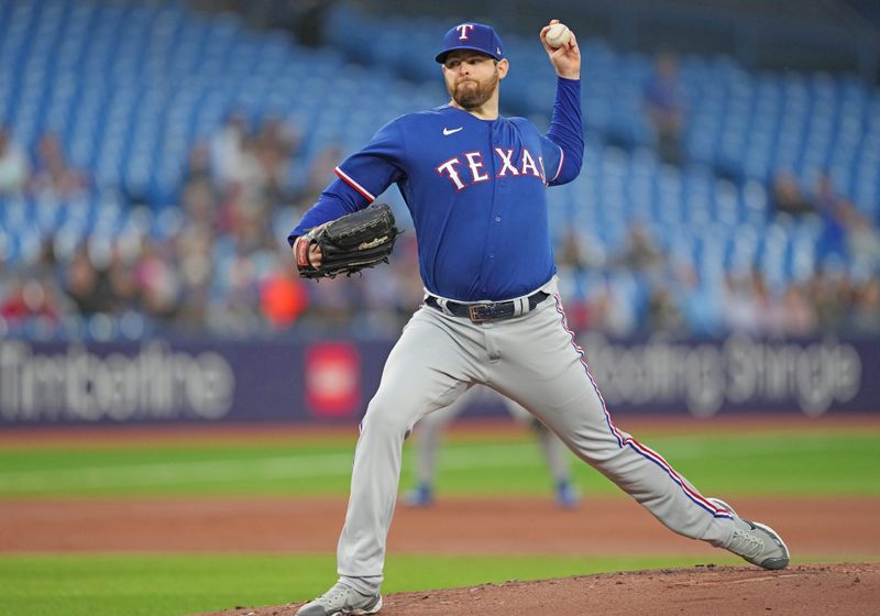 Sep 13, 2023; Toronto, Ontario, CAN; Texas Rangers starting pitcher Jordan Montgomery (52) throws a pitch against the Toronto Blue Jays during the first inning at Rogers Centre. Mandatory Credit: Nick Turchiaro-USA TODAY Sports