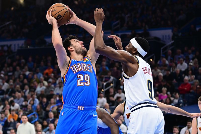 OKLAHOMA CITY, OKLAHOMA - JANUARY 31: Vasilije Micic #29 of the Oklahoma City Thunder goes up for a shot in front of Justin Holiday #9 of the Denver Nuggets during the first half at Paycom Center on January 31, 2024 in Oklahoma City, Oklahoma. NOTE TO USER: User expressly acknowledges and agrees that, by downloading and or using this Photograph, user is consenting to the terms and conditions of the Getty Images License Agreement. (Photo by Joshua Gateley/Getty Images)