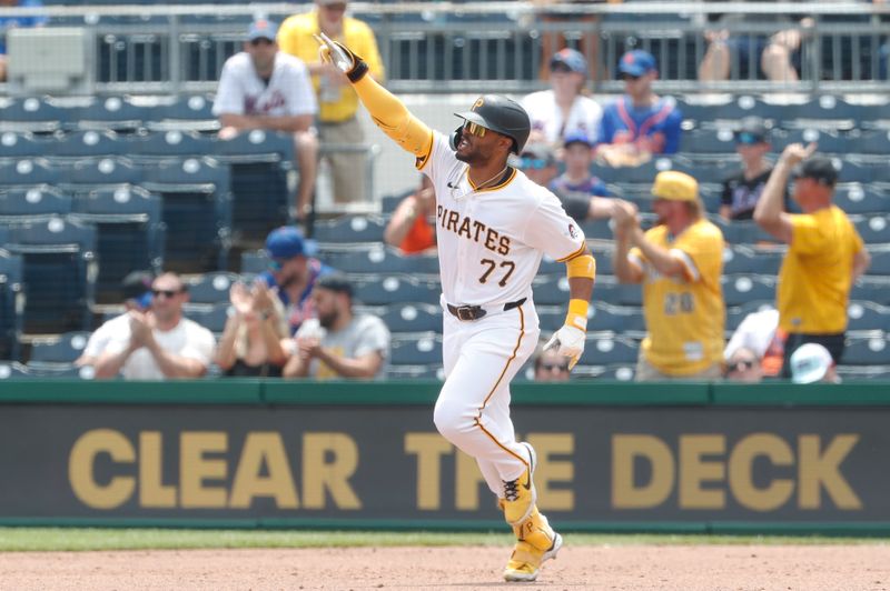 Jul 8, 2024; Pittsburgh, Pennsylvania, USA;  Pittsburgh Pirates right fielder Joshua Palacios (77) gestures as he runs the bases after hitting a solo home run against the New York Mets during the sixth inning at PNC Park. The Pirates won 8-2. Mandatory Credit: Charles LeClaire-USA TODAY Sports