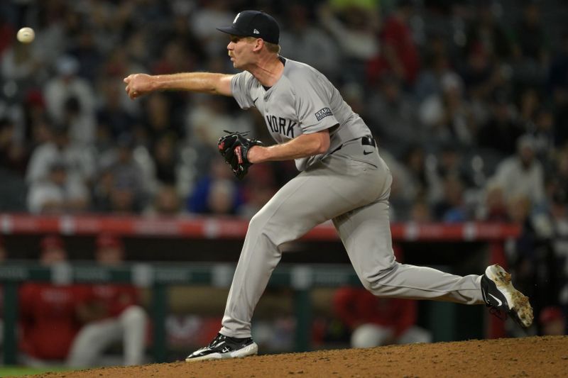 May 30, 2024; Anaheim, California, USA;  New York Yankees relief pitcher Michael Tonkin (50) delivers a pitch in the ninth inning against the Los Angeles Angels at Angel Stadium. Mandatory Credit: Jayne Kamin-Oncea-USA TODAY Sports