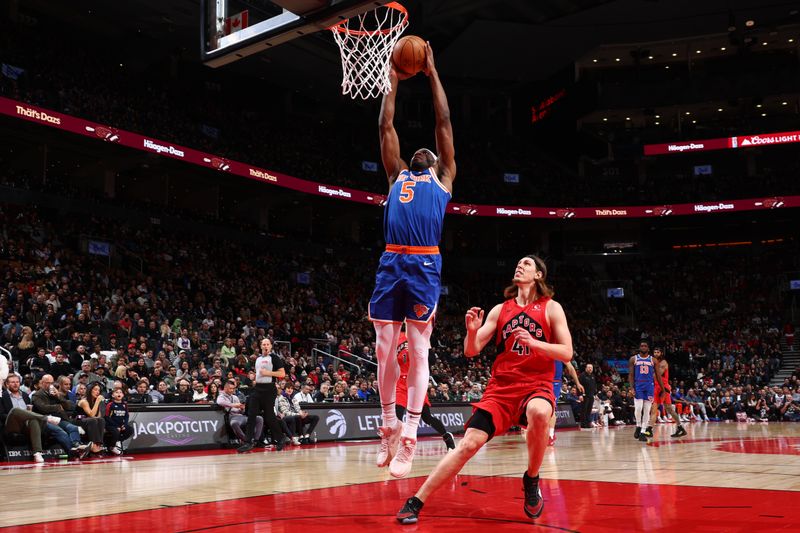 TORONTO, CANADA - MARCH 27: Precious Achiuwa #5 of the New York Knicks dunks the ball during the game against the Toronto Raptors on March 27, 2024 at the Scotiabank Arena in Toronto, Ontario, Canada.  NOTE TO USER: User expressly acknowledges and agrees that, by downloading and or using this Photograph, user is consenting to the terms and conditions of the Getty Images License Agreement.  Mandatory Copyright Notice: Copyright 2024 NBAE (Photo by Vaughn Ridley/NBAE via Getty Images)