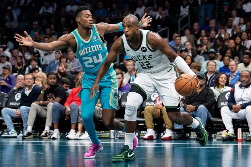 CHARLOTTE, NORTH CAROLINA - NOVEMBER 17: Brandon Miller #24 of the Charlotte Hornets guards Khris Middleton #22 of the Milwaukee Bucks in the second quarter during an NBA In-Season Tournament game at Spectrum Center on November 17, 2023 in Charlotte, North Carolina. NOTE TO USER: User expressly acknowledges and agrees that, by downloading and or using this photograph, User is consenting to the terms and conditions of the Getty Images License Agreement. (Photo by Jacob Kupferman/Getty Images)