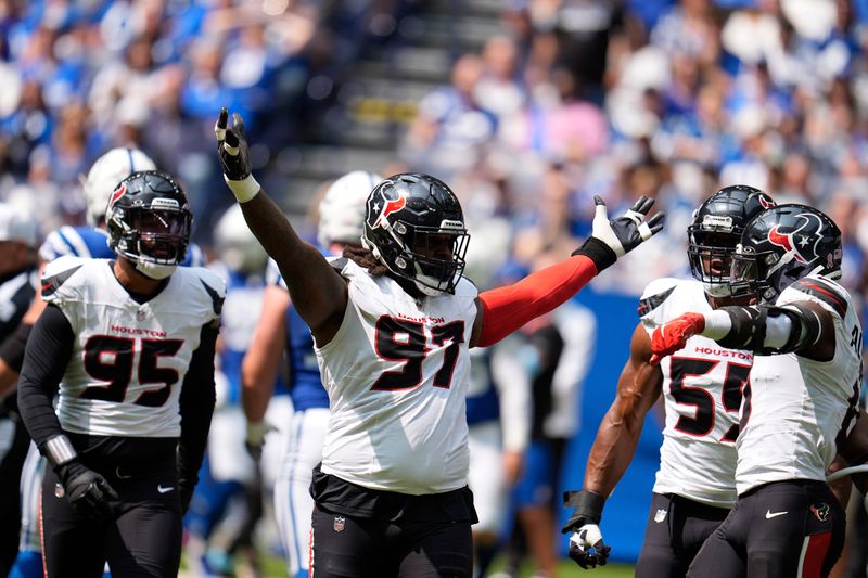 Houston Texans defensive end Mario Edwards Jr. (97) celebrates a quarterback sack during the first half of an NFL football game against the Indianapolis Colts, Sunday, Sept. 8, 2024, in Indianapolis. (AP Photo/Michael Conroy)