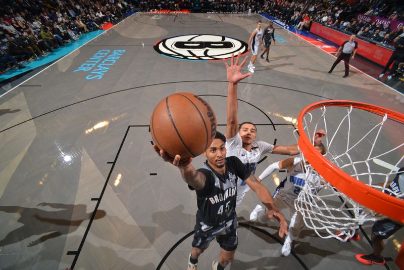 BROOKLYN, NY - DECEMBER 1: Keon Johnson #45 of the Brooklyn Nets drives to the basket during the game against the Orlando Magic on December 1, 2024 at Barclays Center in Brooklyn, New York. NOTE TO USER: User expressly acknowledges and agrees that, by downloading and or using this Photograph, user is consenting to the terms and conditions of the Getty Images License Agreement. Mandatory Copyright Notice: Copyright 2024 NBAE (Photo by Jesse D. Garrabrant/NBAE via Getty Images)