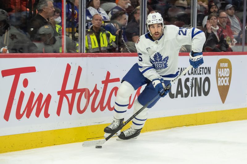 Dec 7, 2023; Ottawa, Ontario, CAN; Toronto Maple Leafs defenseman Conor Timmins (25) skates with the puck in the first period against the Ottawa Senators at the Canadian Tire Centre. Mandatory Credit: Marc DesRosiers-USA TODAY Sports