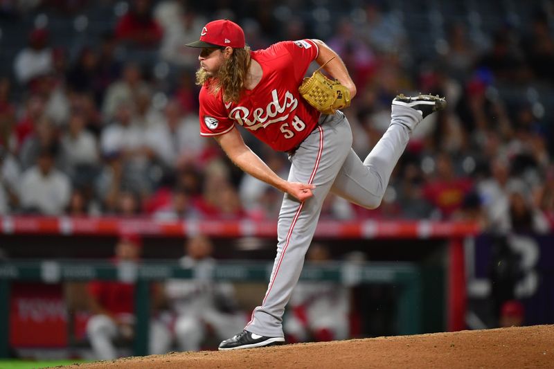 Aug 20, 2025; Anaheim, California, USA; Cincinnati Reds pitcher Scott Barlow (58) throws against the Los Angeles Angels during the seventh inning at Angel Stadium. Mandatory Credit: Gary A. Vasquez-Imagn Images