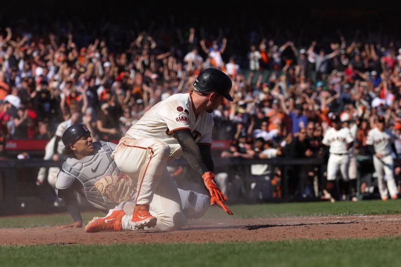 Sep 13, 2023; San Francisco, California, USA; San Francisco Giants catcher Patrick Bailey (14) scores the winning run during the tenth inning against the Cleveland Guardians at Oracle Park. Mandatory Credit: Sergio Estrada-USA TODAY Sports