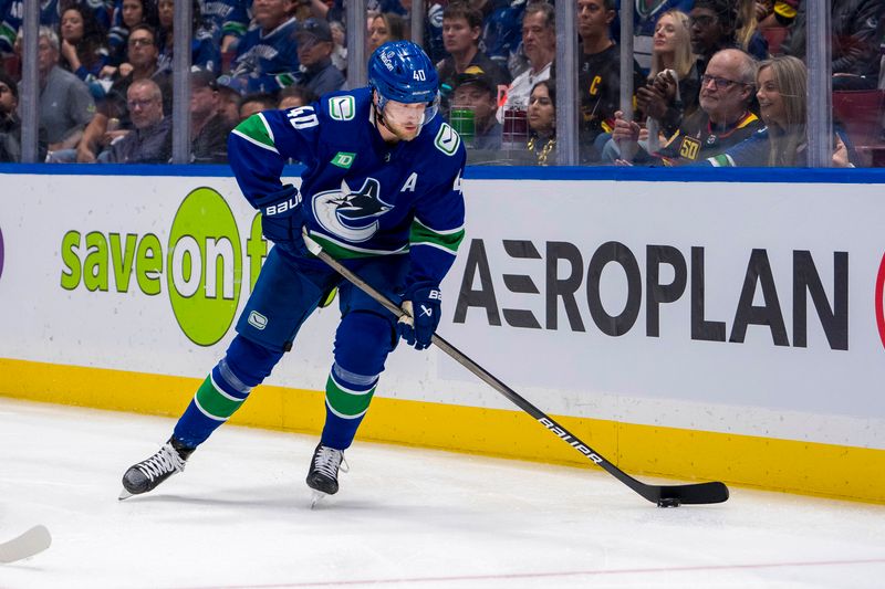 May 10, 2024; Vancouver, British Columbia, CAN; Vancouver Canucks forward Elias Pettersson (40) handles the puck against the Edmonton Oilers during the third period in game two of the second round of the 2024 Stanley Cup Playoffs at Rogers Arena. Mandatory Credit: Bob Frid-USA TODAY Sports