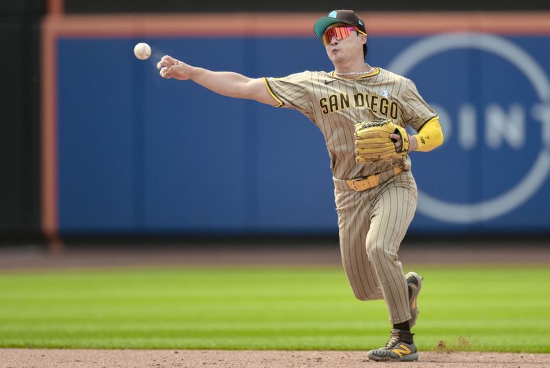 Jun 16, 2024; New York City, New York, USA; San Diego Padres shortstop Ha-Seong Kim (7) fields a ground ball and throws to first base for an out during the sixth inning against the New York Mets at Citi Field. Mandatory Credit: John Jones-USA TODAY Sports