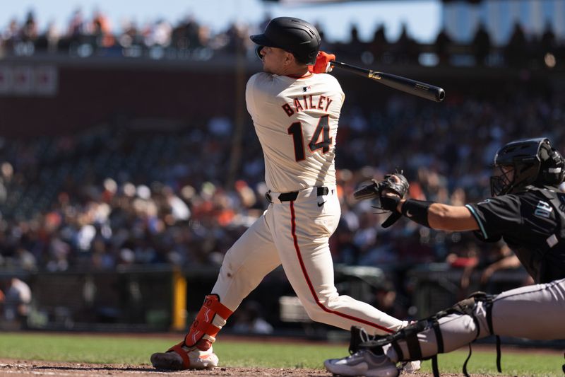 Sep 5, 2024; San Francisco, California, USA;  San Francisco Giants catcher Patrick Bailey (14) hits a walk off double to win the game against the Arizona Diamondbacks at Oracle Park. Mandatory Credit: Stan Szeto-Imagn Images