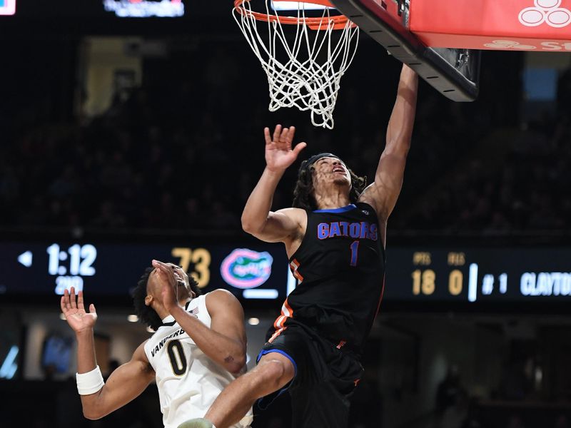 Mar 9, 2024; Nashville, Tennessee, USA; Florida Gators guard Walter Clayton Jr. (1) scores as he is fouled by Vanderbilt Commodores guard Tyrin Lawrence (0) during the second half at Memorial Gymnasium. Mandatory Credit: Christopher Hanewinckel-USA TODAY Sports