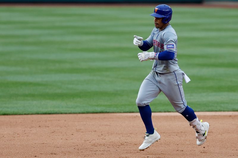 Jun 5, 2024; Washington, District of Columbia, USA; New York Mets shortstop Francisco Lindor (12) gestures towards  his dugout while rounding the bases after hitting a solo home run against the Washington Nationals during the sixth inning at Nationals Park. Mandatory Credit: Geoff Burke-USA TODAY Sports