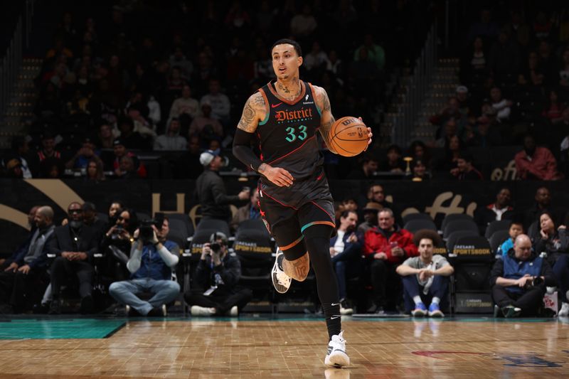 WASHINGTON, DC -? FEBRUARY 25: Kyle Kuzma #33 of the Washington Wizards dribbles the ball during the game against the Cleveland Cavaliers on February 25, 2024 at Capital One Arena in Washington, DC. NOTE TO USER: User expressly acknowledges and agrees that, by downloading and or using this Photograph, user is consenting to the terms and conditions of the Getty Images License Agreement. Mandatory Copyright Notice: Copyright 2024 NBAE (Photo by Stephen Gosling/NBAE via Getty Images)