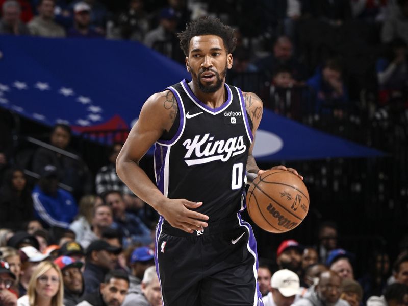 PHILADELPHIA, PA - JANUARY 12:  Malik Monk #0 of the Sacramento Kings handles the ball during the game  on January 12, 2024 at the Wells Fargo Center in Philadelphia, Pennsylvania NOTE TO USER: User expressly acknowledges and agrees that, by downloading and/or using this Photograph, user is consenting to the terms and conditions of the Getty Images License Agreement. Mandatory Copyright Notice: Copyright 2024 NBAE (Photo by David Dow/NBAE via Getty Images)