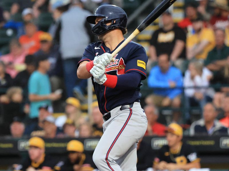 Mar 12, 2026; Bradenton, Florida, USA;  Atlanta Braves infielder Kyle Farmer (15)  hits an RBI single during the sixth inning against the Pittsburgh Pirates at LECOM Park. Mandatory Credit: Kim Klement Neitzel-Imagn Images