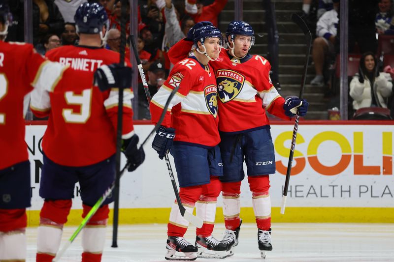 Apr 16, 2024; Sunrise, Florida, USA; Florida Panthers center Carter Verhaeghe (23) celebrates with defenseman Gustav Forsling (42) after scoring against the Toronto Maple Leafs at Amerant Bank Arena. Mandatory Credit: Sam Navarro-USA TODAY Sports