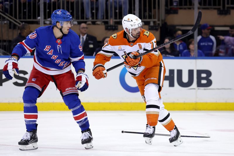 Oct 26, 2024; New York, New York, USA; Anaheim Ducks left wing Alex Killorn (17) follows through on a shot against New York Rangers left wing Will Cuylle (50) during the second period at Madison Square Garden. Mandatory Credit: Brad Penner-Imagn Images