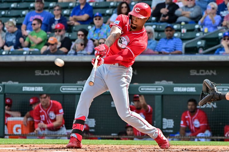 Feb 27, 2024; Mesa, Arizona, USA;  Cincinnati Reds right fielder Will Benson (30) triples in the second inning against the Chicago Cubs during a spring training game at Sloan Park. Mandatory Credit: Matt Kartozian-USA TODAY Sports