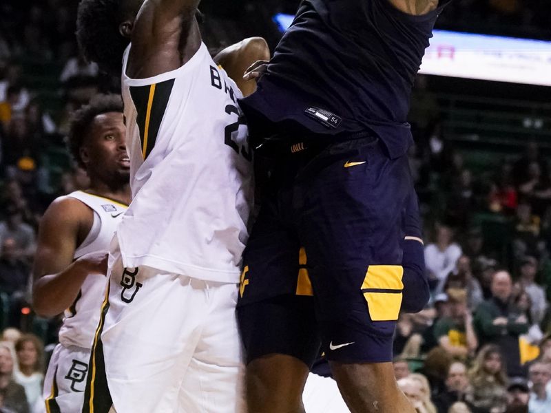 Feb 13, 2023; Waco, Texas, USA; West Virginia Mountaineers forward Jimmy Bell Jr. (15) shoots over Baylor Bears forward Jonathan Tchamwa Tchatchoua (23) during the first half at Ferrell Center. Mandatory Credit: Raymond Carlin III-USA TODAY Sports