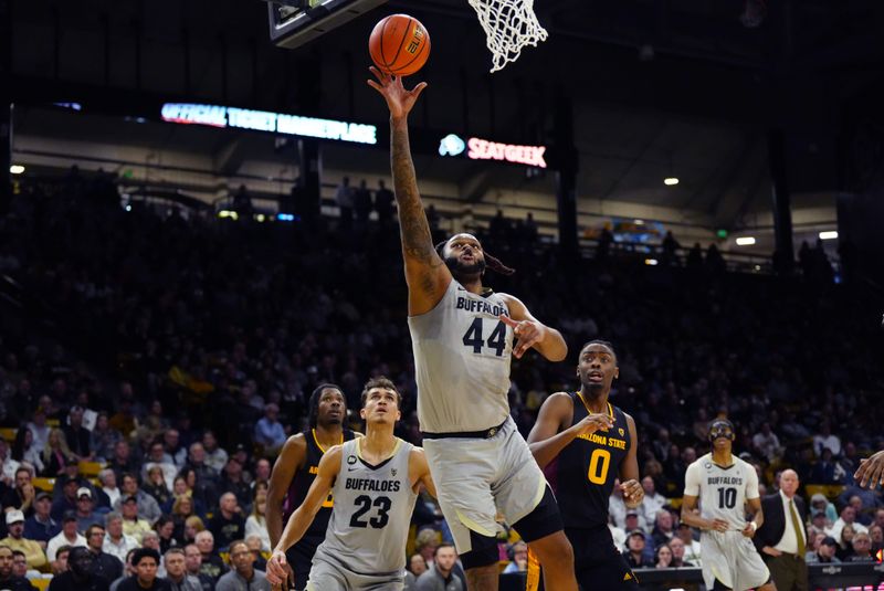 Feb 8, 2024; Boulder, Colorado, USA; Colorado Buffaloes center Eddie Lampkin Jr. (44) shoots the ball past Arizona State Sun Devils guard Kamari Lands (0) in the second half at the CU Events Center. Mandatory Credit: Ron Chenoy-USA TODAY Sports